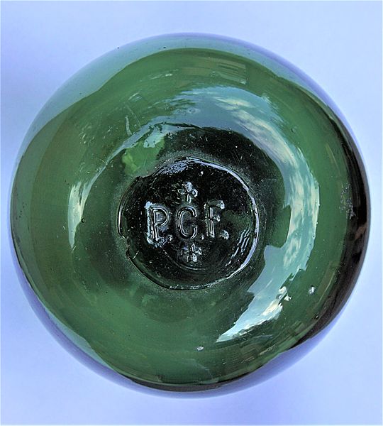 Early glass fishing float embossed 'P.C.F' - Click for the bigger picture